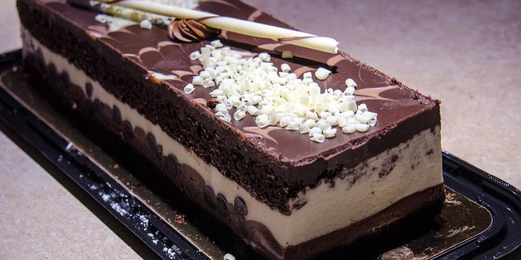 Raw chocolate cream cake topped with chocolate mouse chocolate mousse cake
