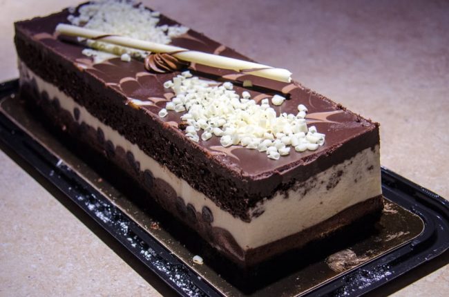 Raw chocolate cream cake topped with chocolate mouse chocolate mousse cake